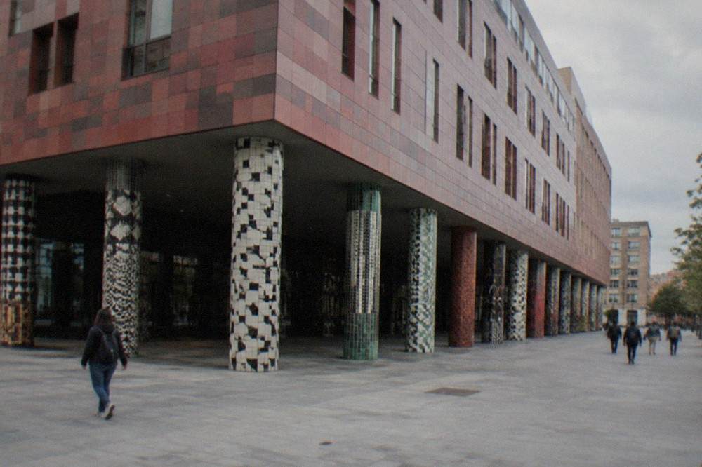 The tiled facade of the Azkuna Zentroa cultural centre on a busy Bilbao street