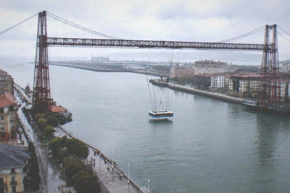 The Vizcaya transporter bridge carrying its gondola across the river at Portugalete